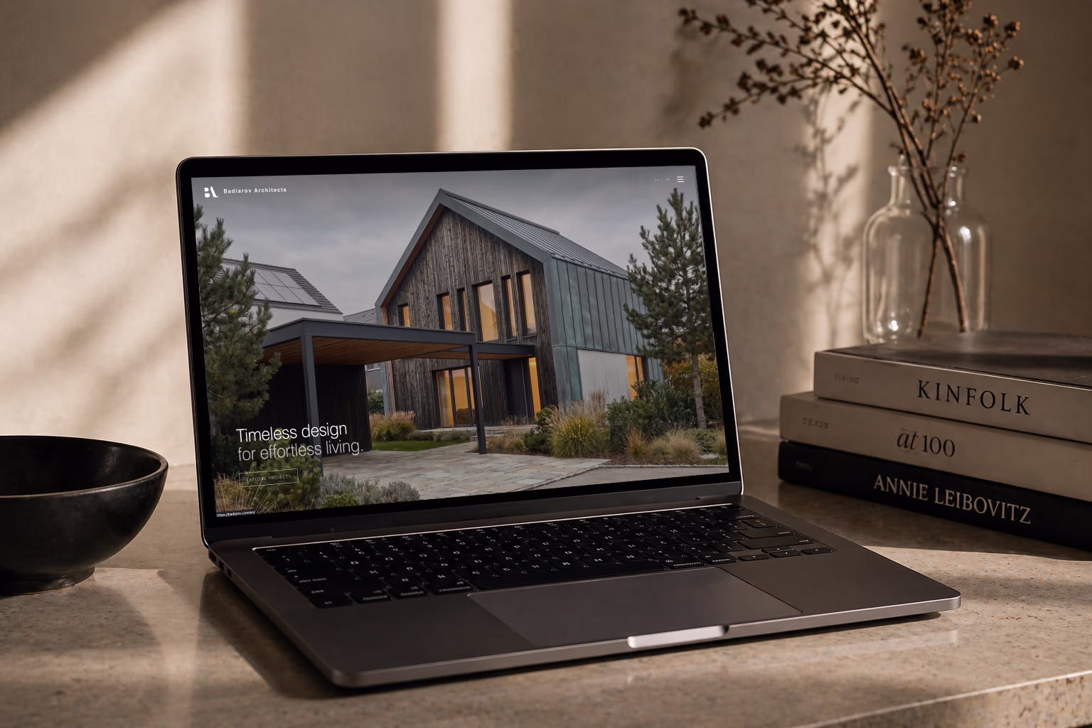 Laptop displaying a refined architecture website